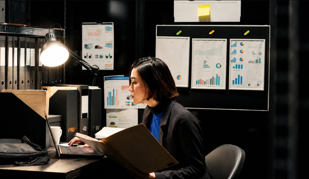 Focused Analyst in a Chart-Lined Office