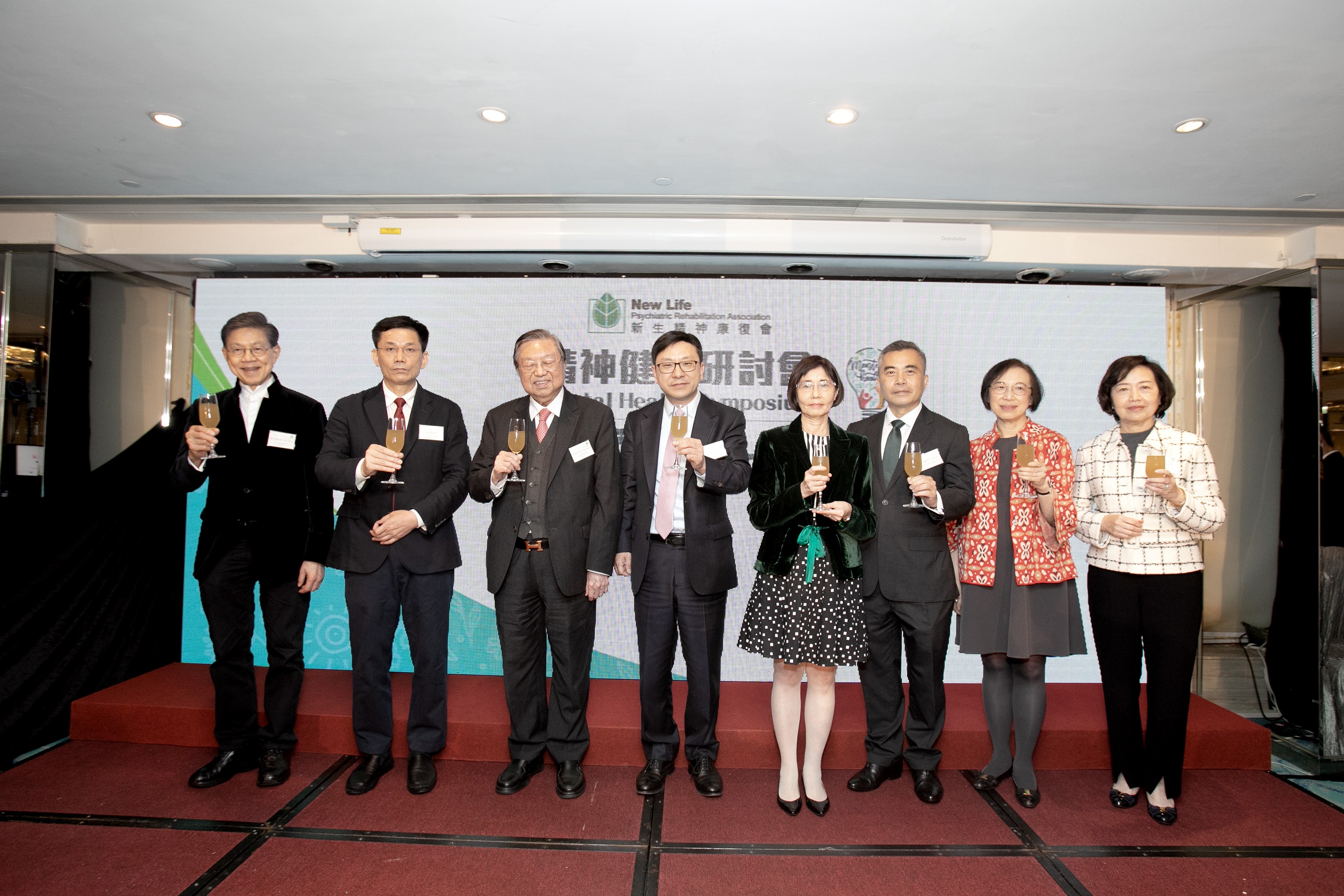 At the annual dinner of New Life Psychiatric Rehabilitation Association, all the guests of honor made a toast together: (From the left) Vice-President of NLPRA, Prof. YEOH Eng-kiong, GBS, OBE, JP; Deputy Director-General of the Department of Social Work, of the Liaison Office of the Central People's Government in the HKSAR Mr. ZHOU He; the Secretary for Labour and Welfare, Mr. Chris SUN Yuk-han, JP; Patron of NLPRA, Mr. HO Sai-chu, GBM, GBS, JP; Chairperson of Executive Committee of NLPRA, Prof. Annie TAM Kam-lan, GBS, JP; the Chairman of the Advisory Committee on Mental Health, Mr WONG Yan-lung, GBM, SC; Professor, School of Nursing, The University of Hong Kong, Former Secretary for Food and Health, Prof. Sophia CHAN Siu-chee, GBS, JP; and Vice-President of NLPRA, Mrs. Susan So, SBS.