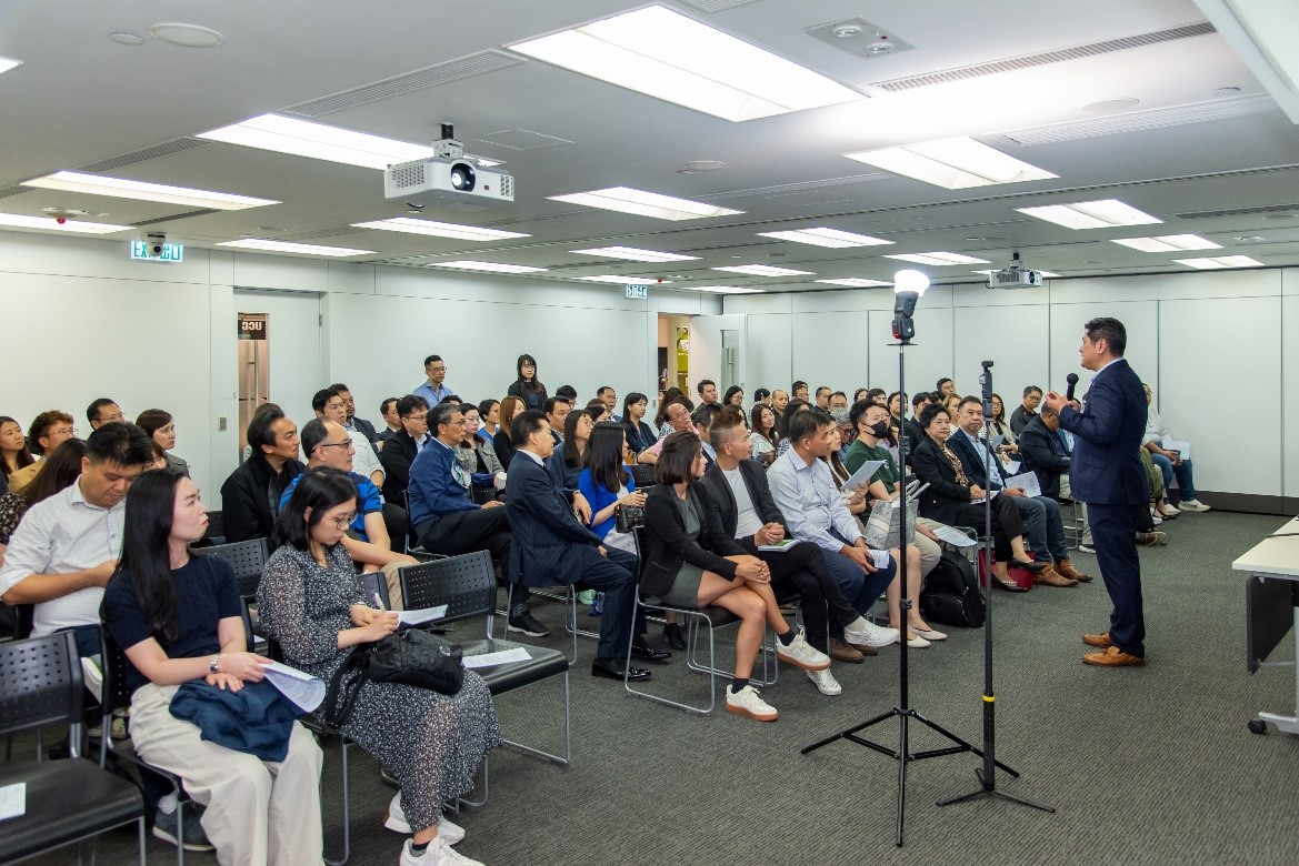 Audience attentively listens to an ESG research presentation at the ICSD event.