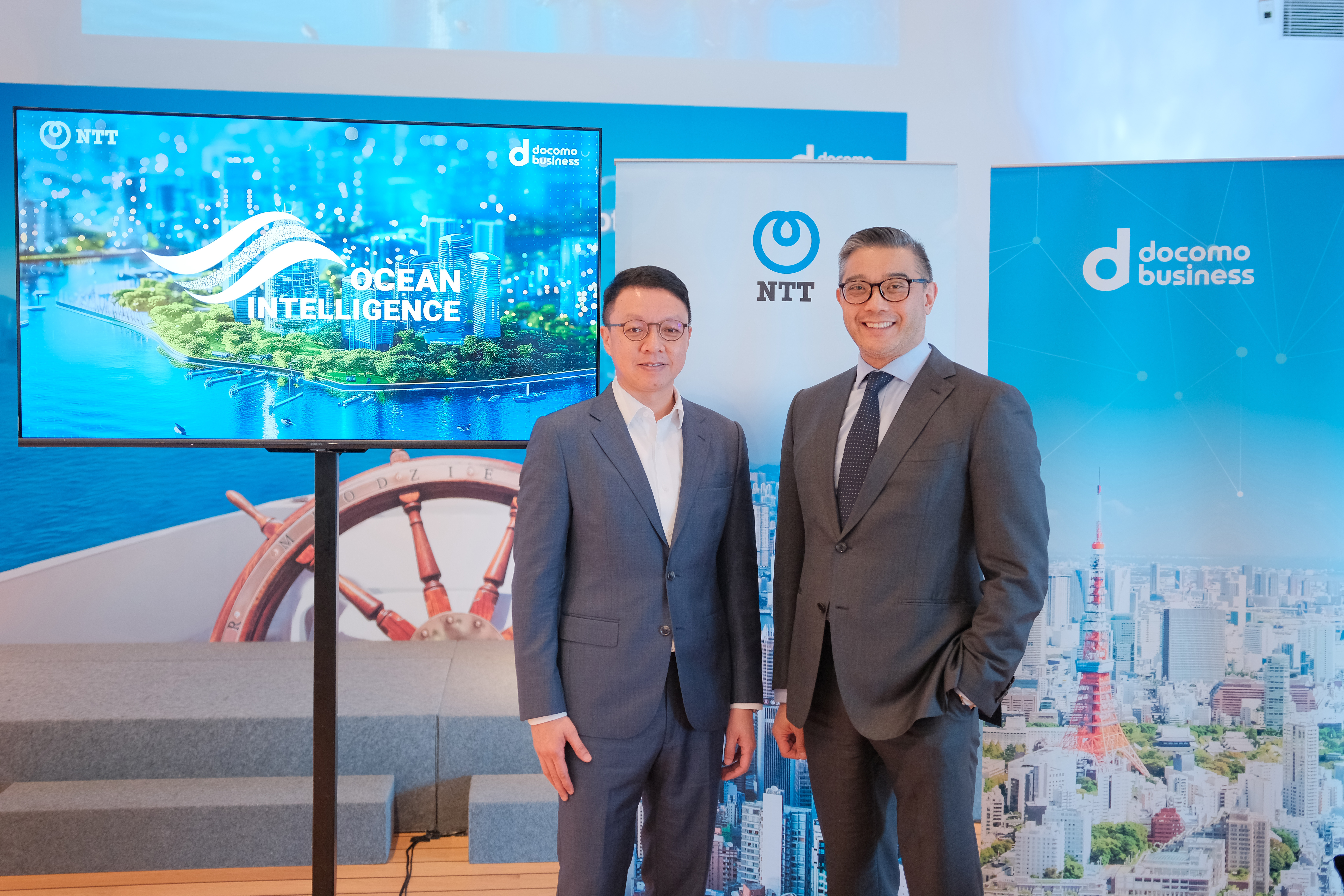 The photo features Steven So, Senior Vice President, NTT Com Asia (left) and Stephen Tsang, Chief Revenue Officer, NTT Com Asia (right).