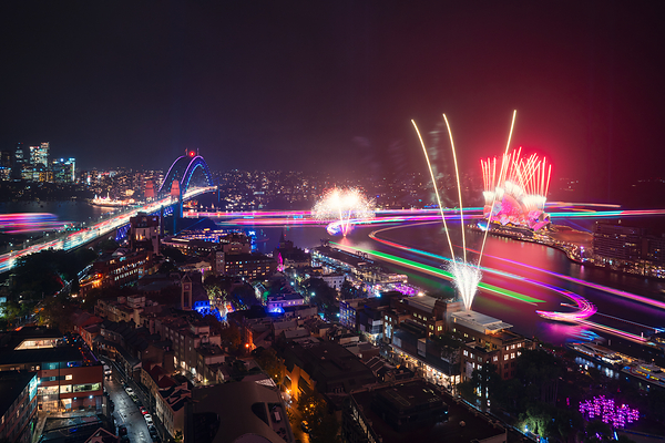 A panoramic night view of Sydney showcasing Vivid Sydney 2026, with fireworks illuminating the sky above the Sydney Opera House and Harbour Bridge A panoramic night view of Sydney showcasing Vivid Sydney 2026, with fireworks illuminating the sky above the Sydney Opera House and Harbour Bridge