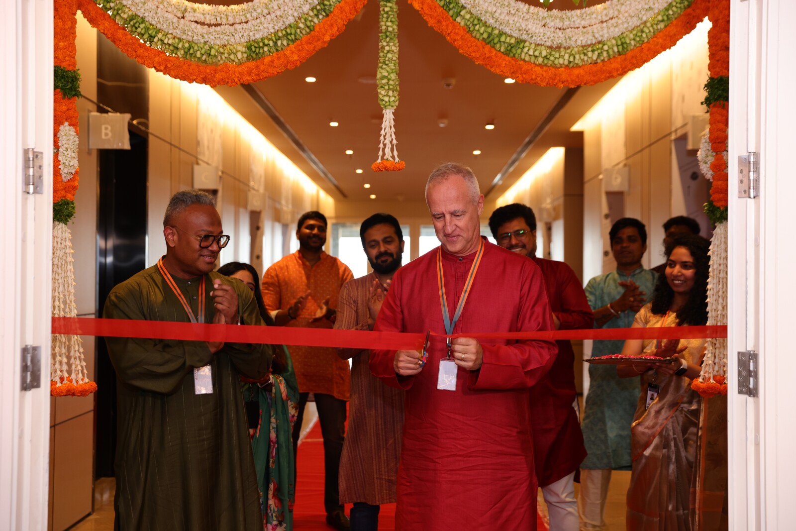 TDCX Founder and CEO Laurent Junique (center) cuts the ribbon at the company