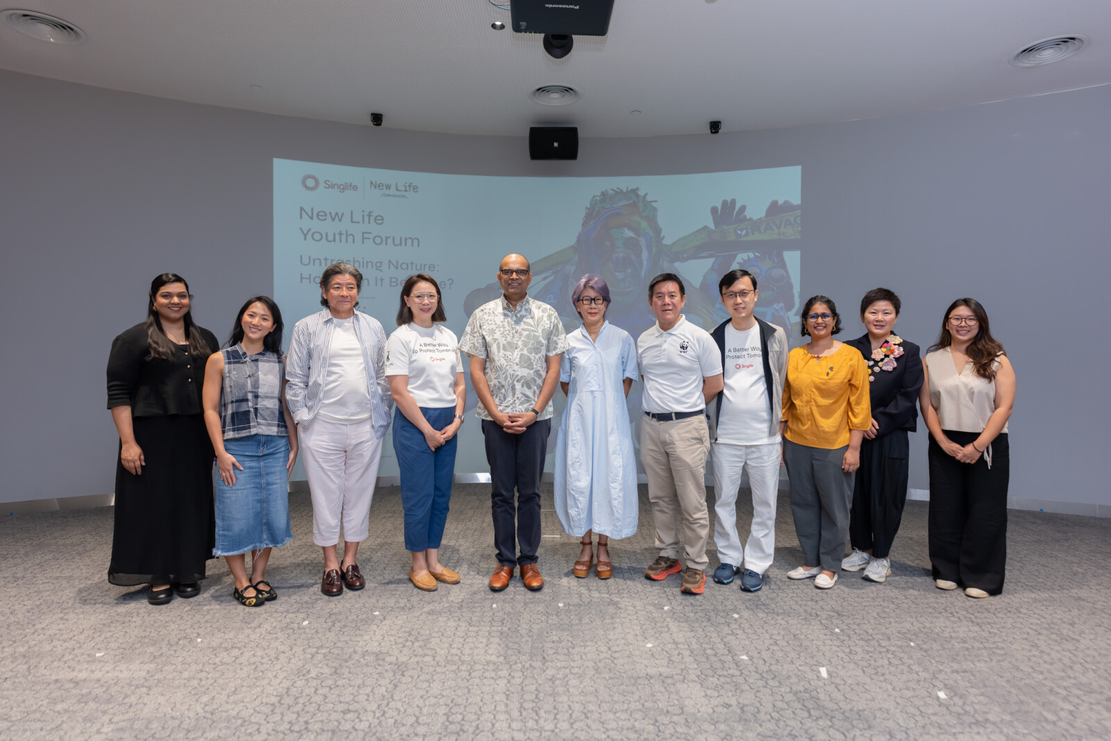Dr Janil Puthucheary, Senior Minister of State, Ministry of Education and Ministry of Sustainability and the Environment, with panellists, moderator, emcee and organisers at the inaugural New Life Youth Forum at Central Library on 24 October 2026. (From left) Nava Neethasnath, Founder, Togather for Good; Chan Kah Mun, Sustainability Advocate and Storyteller, How Light Falls; Adrian Tan, Founder, Ad Planet Group; Wei Lin Chin, Group Head of People, Singlife; Dr Janil Puthucheary; Tan Shook Wah, Director, Projects, Ad Planet Group; Chew Sutat, Chief Executive Officer, WWF-Singapore; Chia Ko Wen, Head of Sustainability, Singlife; Jayasri Narayanan, Assistant Director, Conservation and Science, WWF-Singapore; Dr Dee Chia, Deputy Director, Audience Development, National Gallery Singapore; and Joline Tang, Founder, The Sustainability Project.
